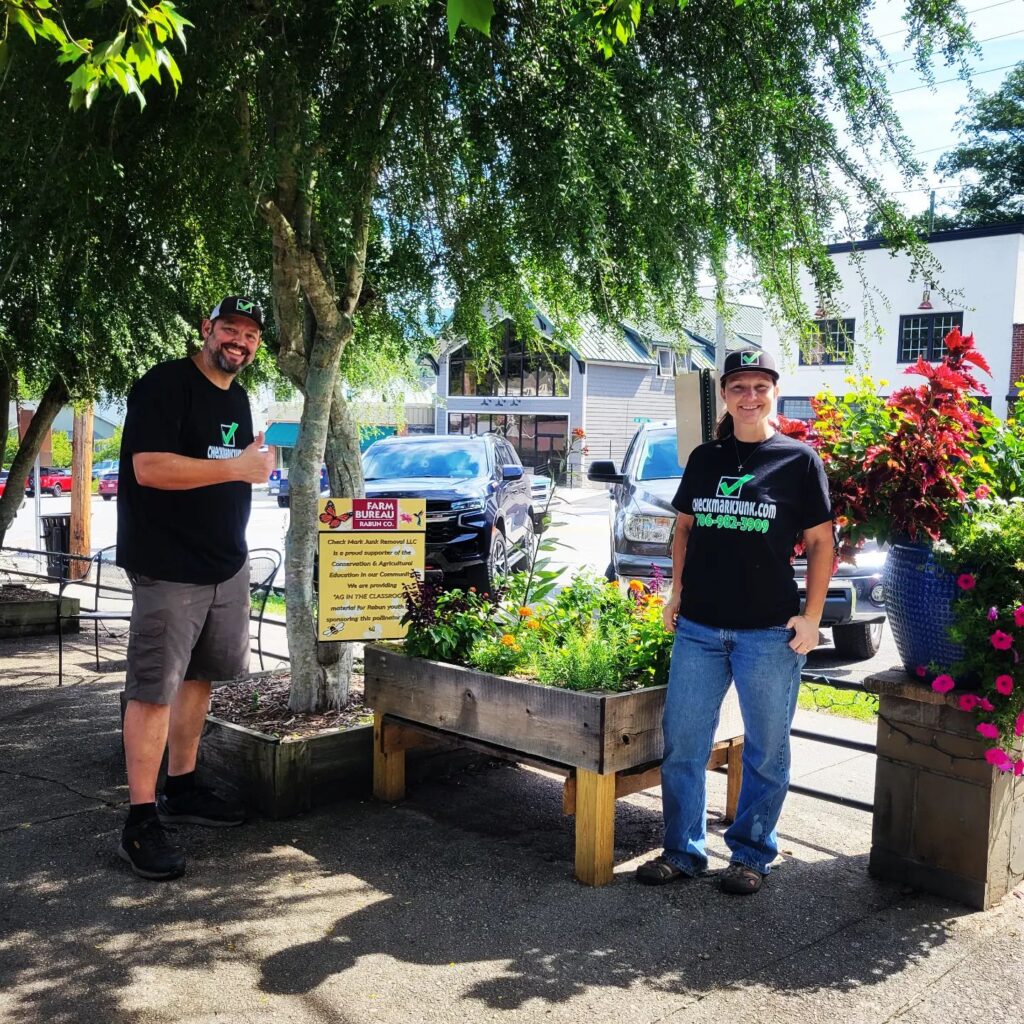 owner operators with Check Mark Junk Removal-sponsored Farm Bureau planter