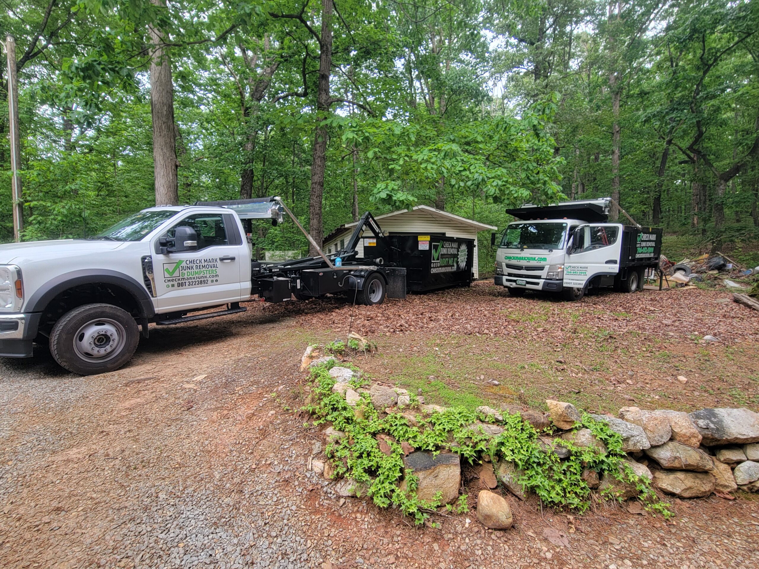 hooklift truck dump truck on site for outdoor cleanup